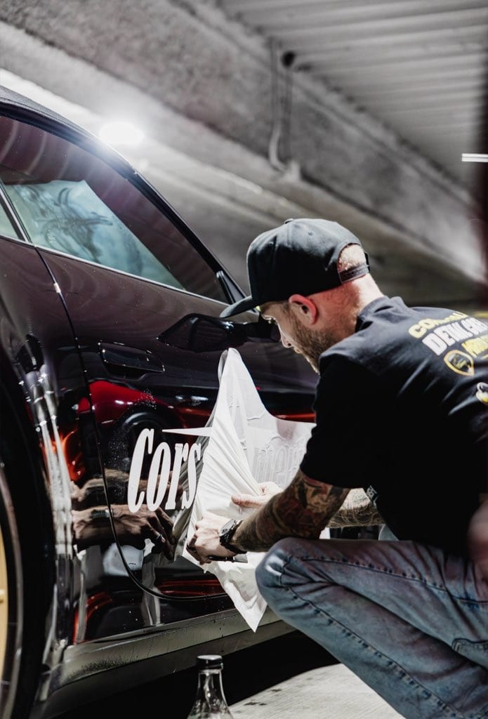 Nico applying Corsa livery to a rally supercar
